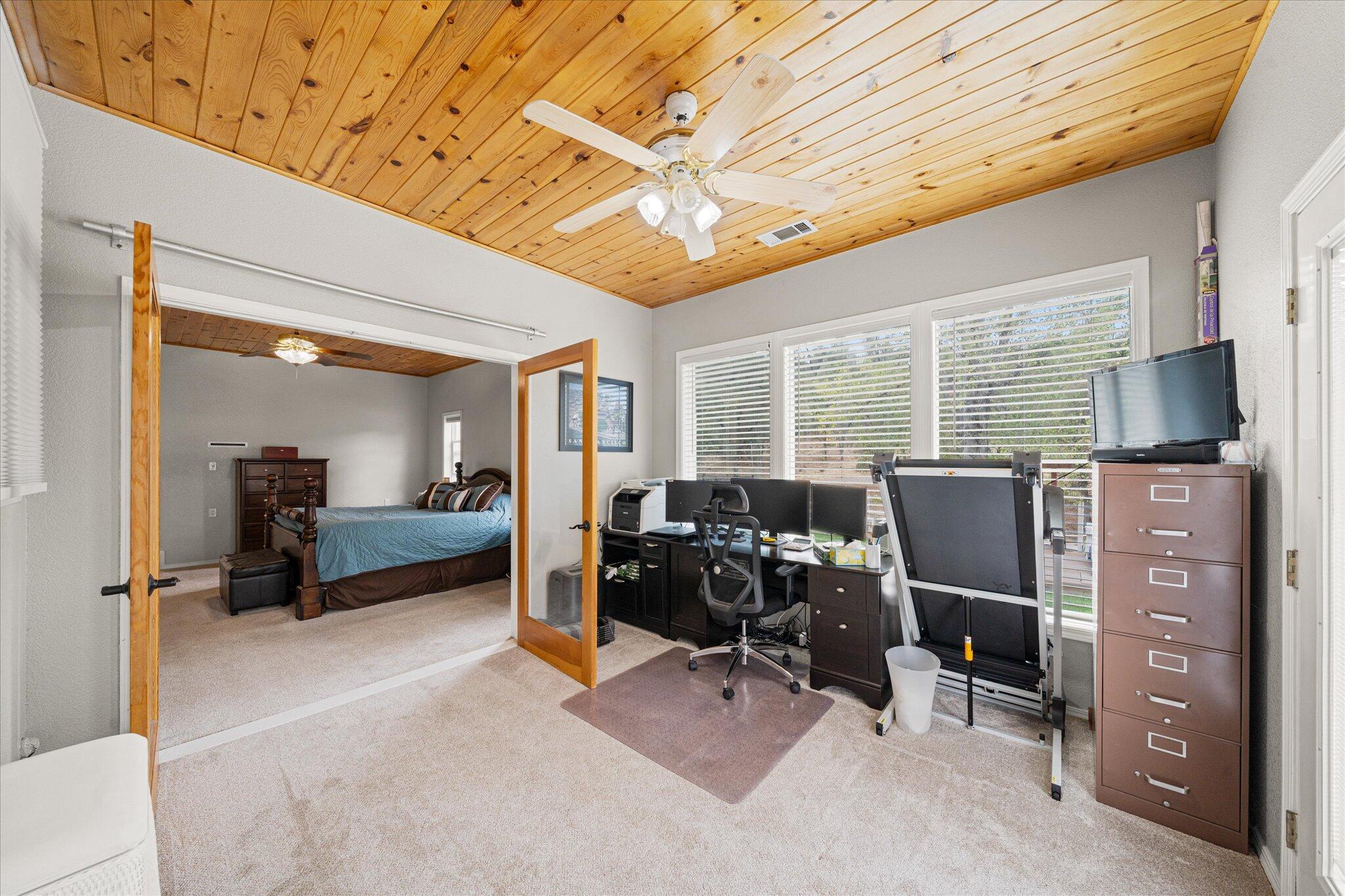 10190 Oak Run Road Oak Run, CA 96069 - Photo 27 of 81 a view of a workspace with furniture and a window