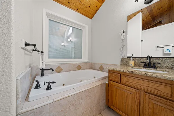 a bedroom with furniture and natural light