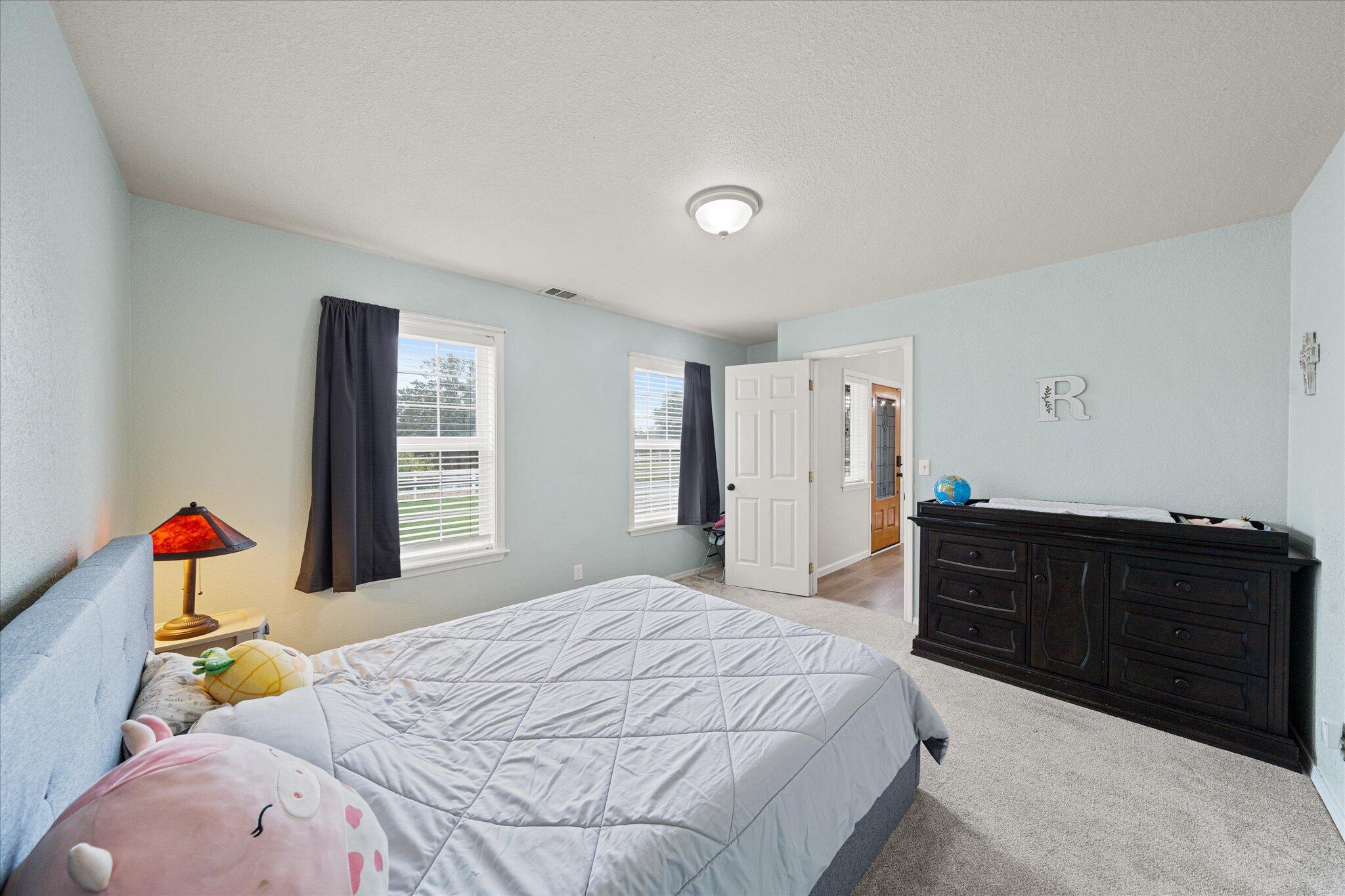 10190 Oak Run Road Oak Run, CA 96069 - Photo 33 of 81 a bedroom with a bed and dresser