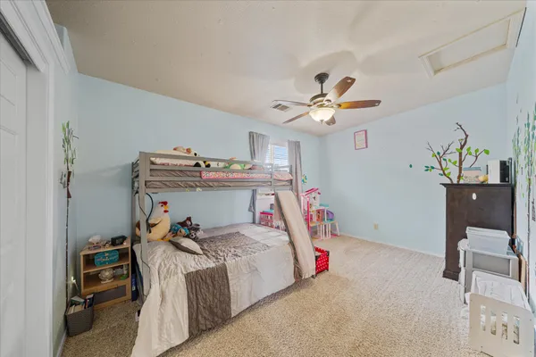 a view of a swimming pool with sitting area