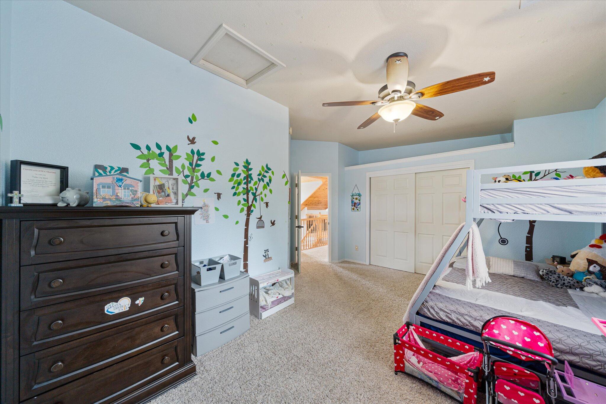 10190 Oak Run Road Oak Run, CA 96069 - Photo 40 of 81 a bedroom with a bed and a chandelier