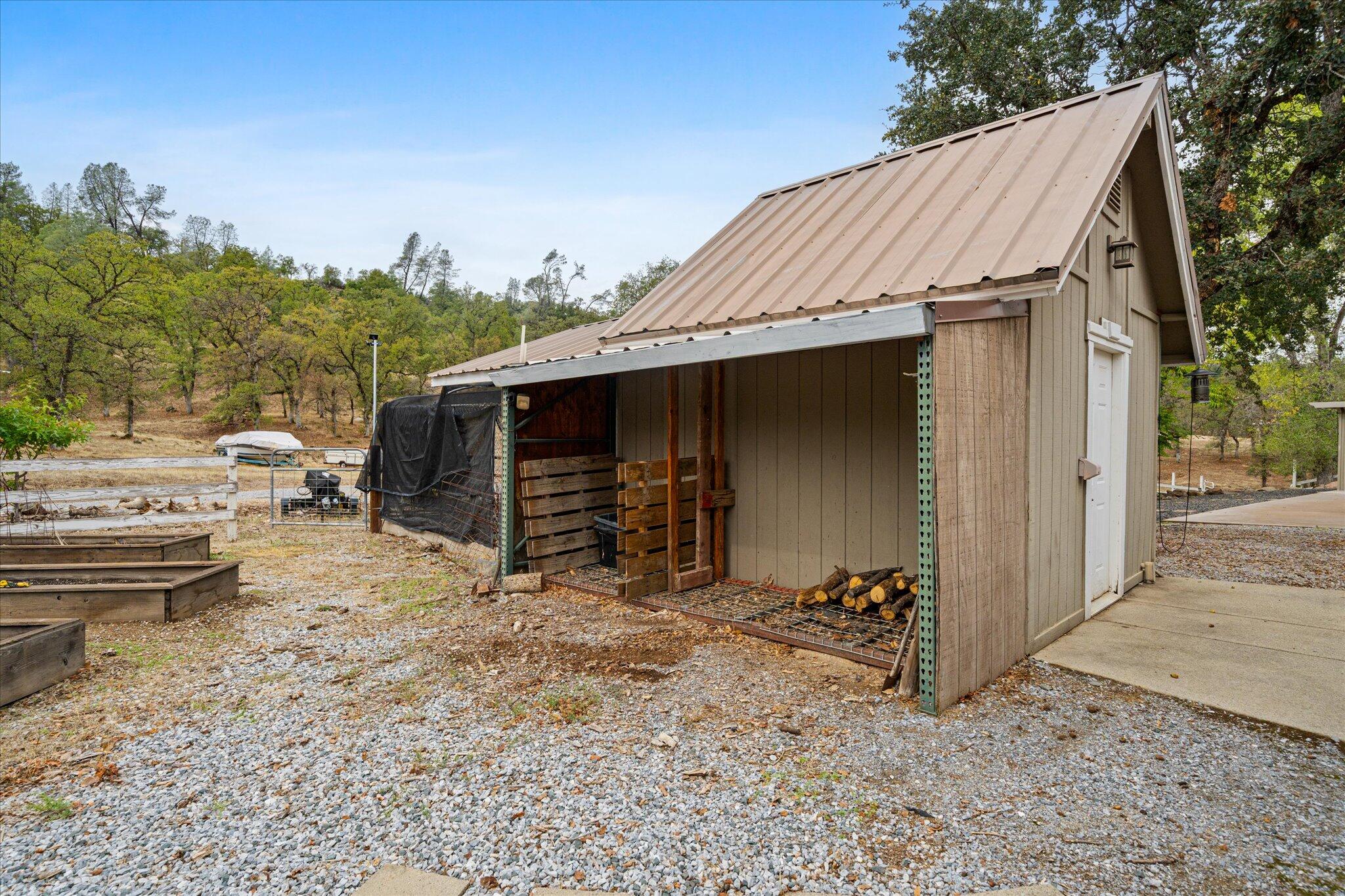 10190 Oak Run Road Oak Run, CA 96069 - Photo 65 of 81 a backyard of a house with barbeque oven and outdoor seating