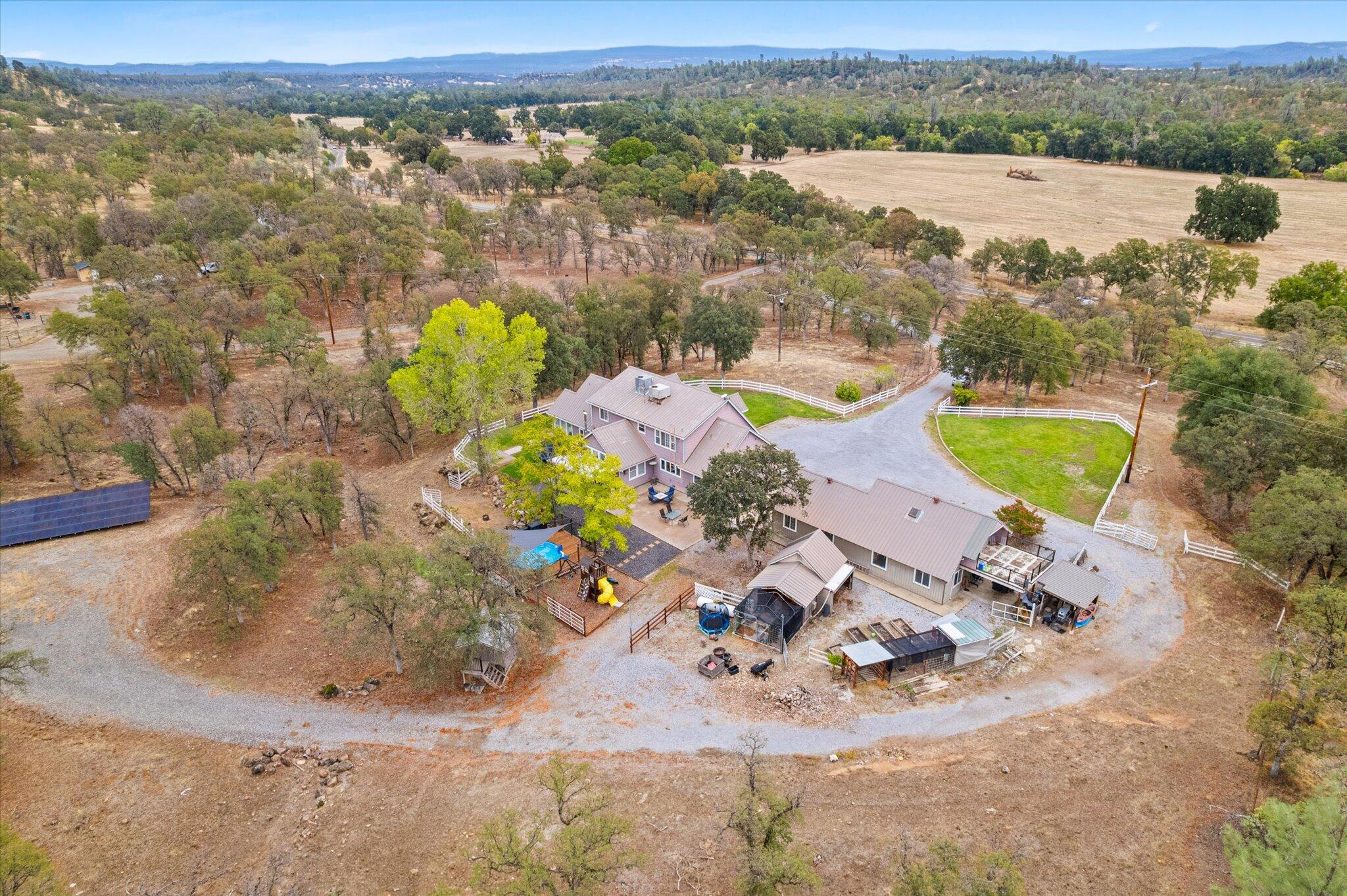 10190 Oak Run Road Oak Run, CA 96069 - Photo 77 of 81 an aerial view of a house with a swimming pool