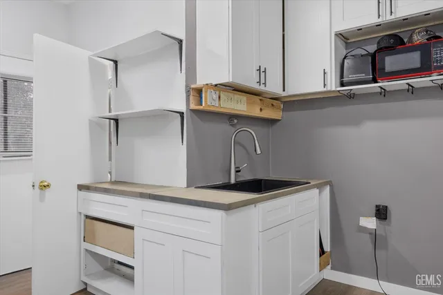 a white toilet sitting next to a shower