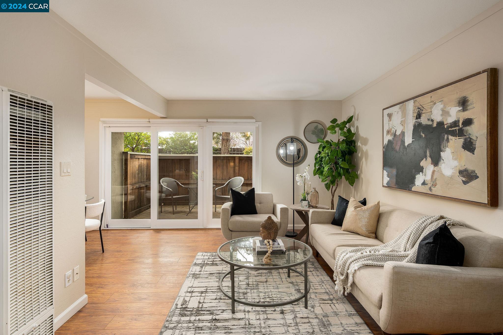 2418 Pleasant Hill Road, Unit 2 Pleasant Hill, CA 94523 - Photo 1 of 1 a living room with furniture and a large window