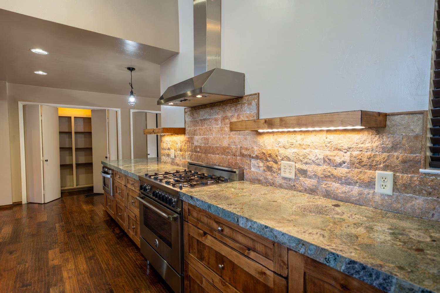 118 Main Street Murphys, CA 95247 - Photo 15 of 47 a kitchen with a stove and a wooden floor