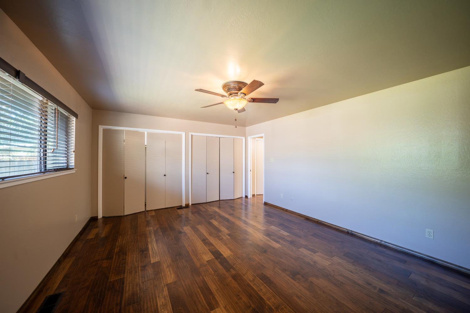 118 Main Street Murphys, CA 95247 - Photo 21 of 47 a view of a room with wooden floor and a ceiling fan
