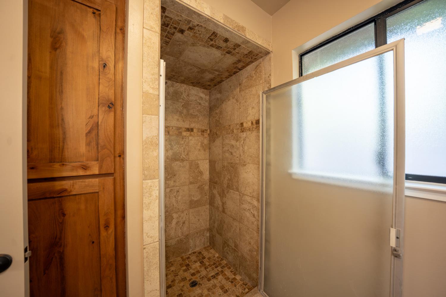 118 Main Street Murphys, CA 95247 - Photo 25 of 47 a bathroom with a shower and a door