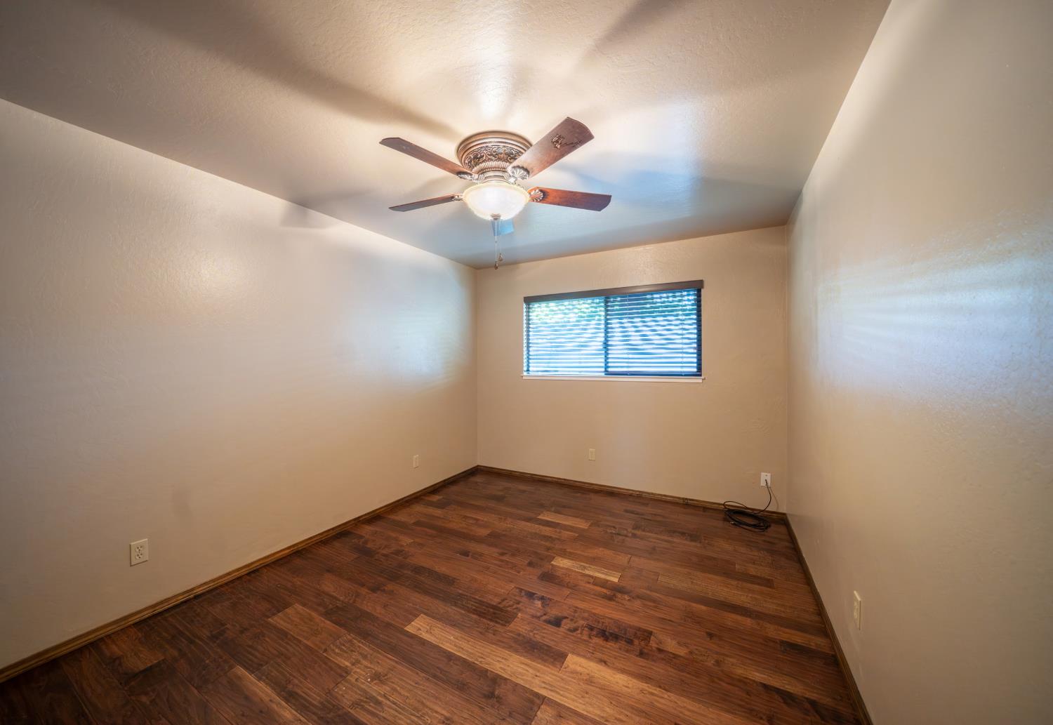 118 Main Street Murphys, CA 95247 - Photo 30 of 47 a view of a big room with wooden floor and a chandelier fan