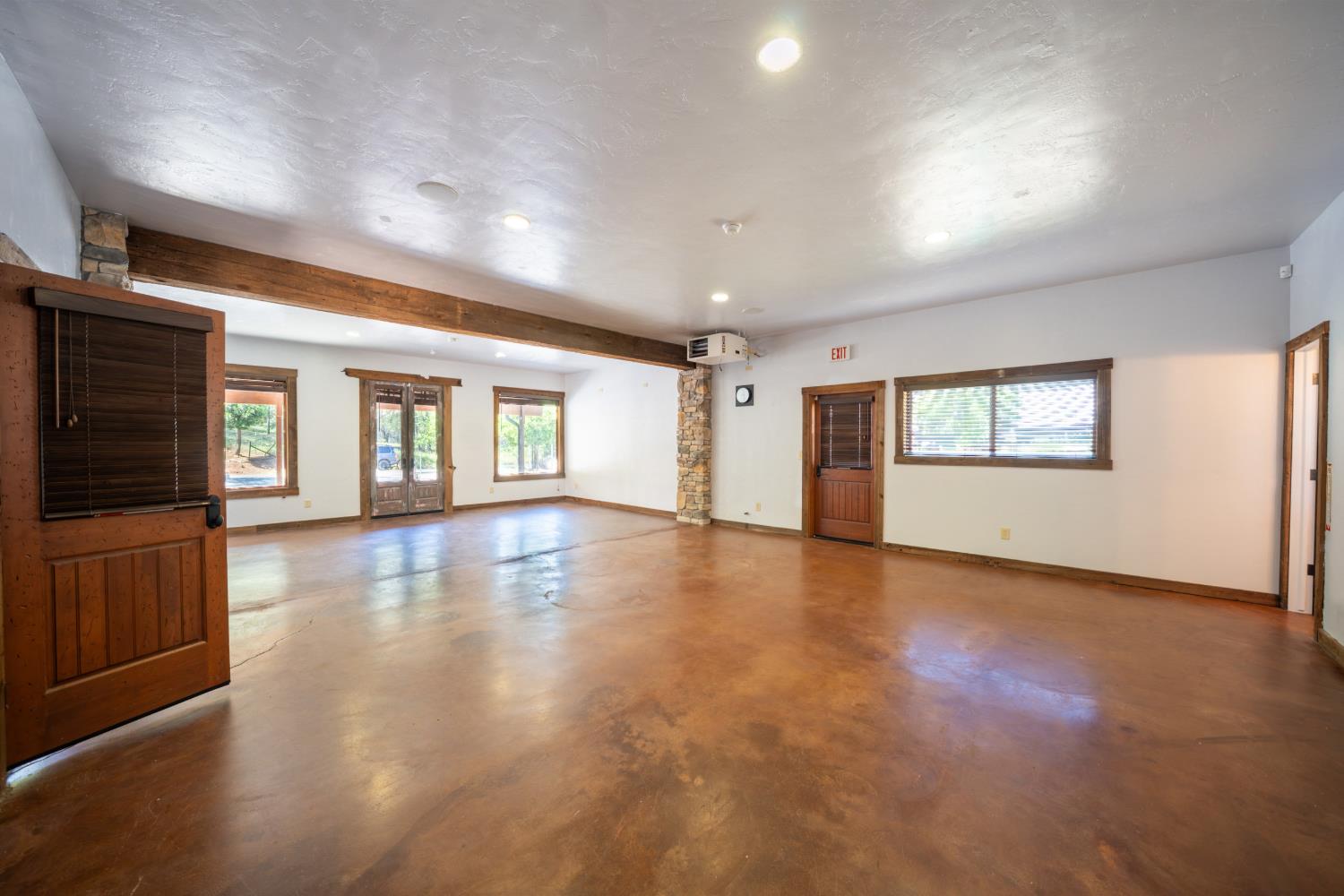 118 Main Street Murphys, CA 95247 - Photo 35 of 47 an empty room with wooden floor and windows