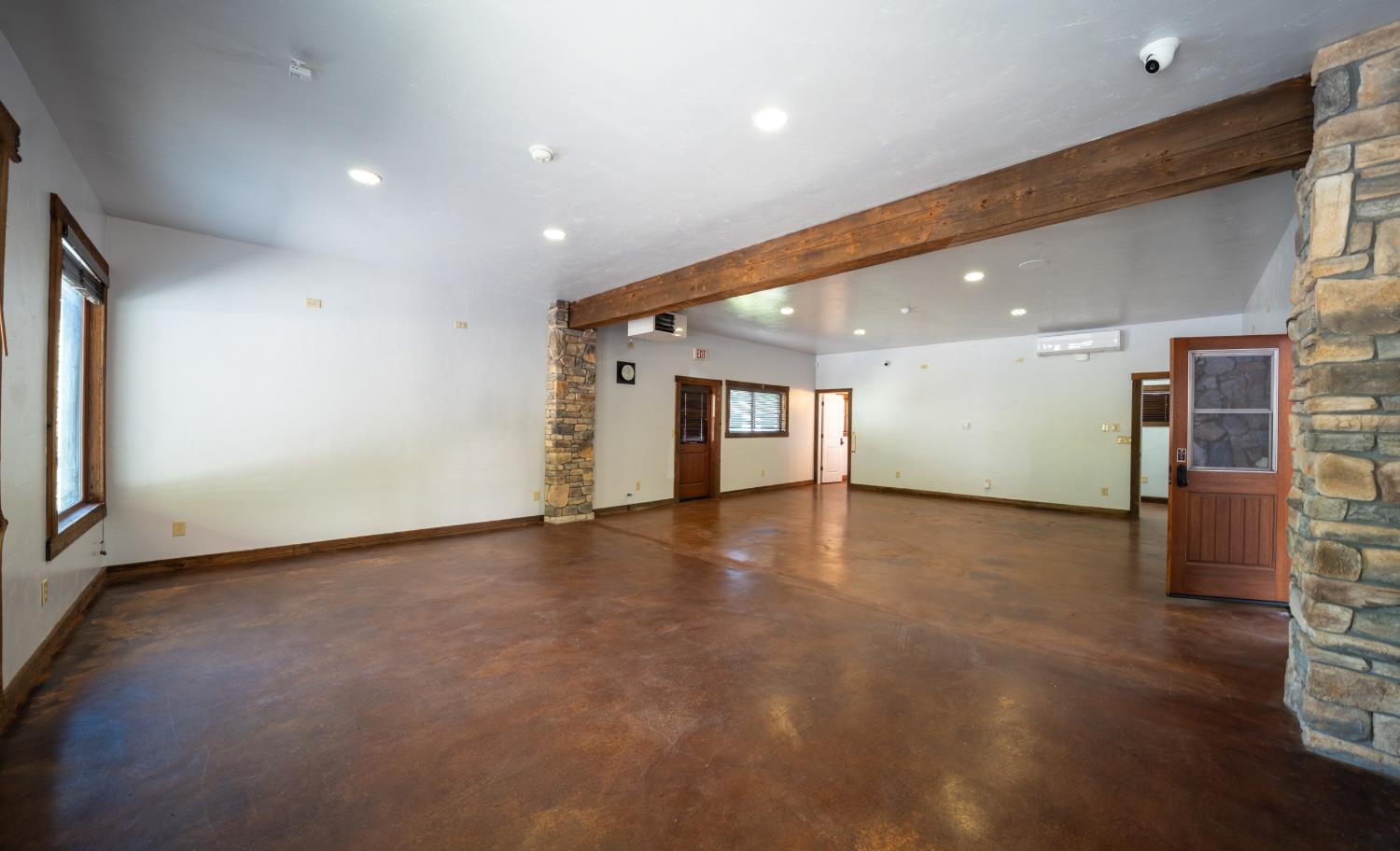 118 Main Street Murphys, CA 95247 - Photo 36 of 47 an empty room with wooden floor and windows
