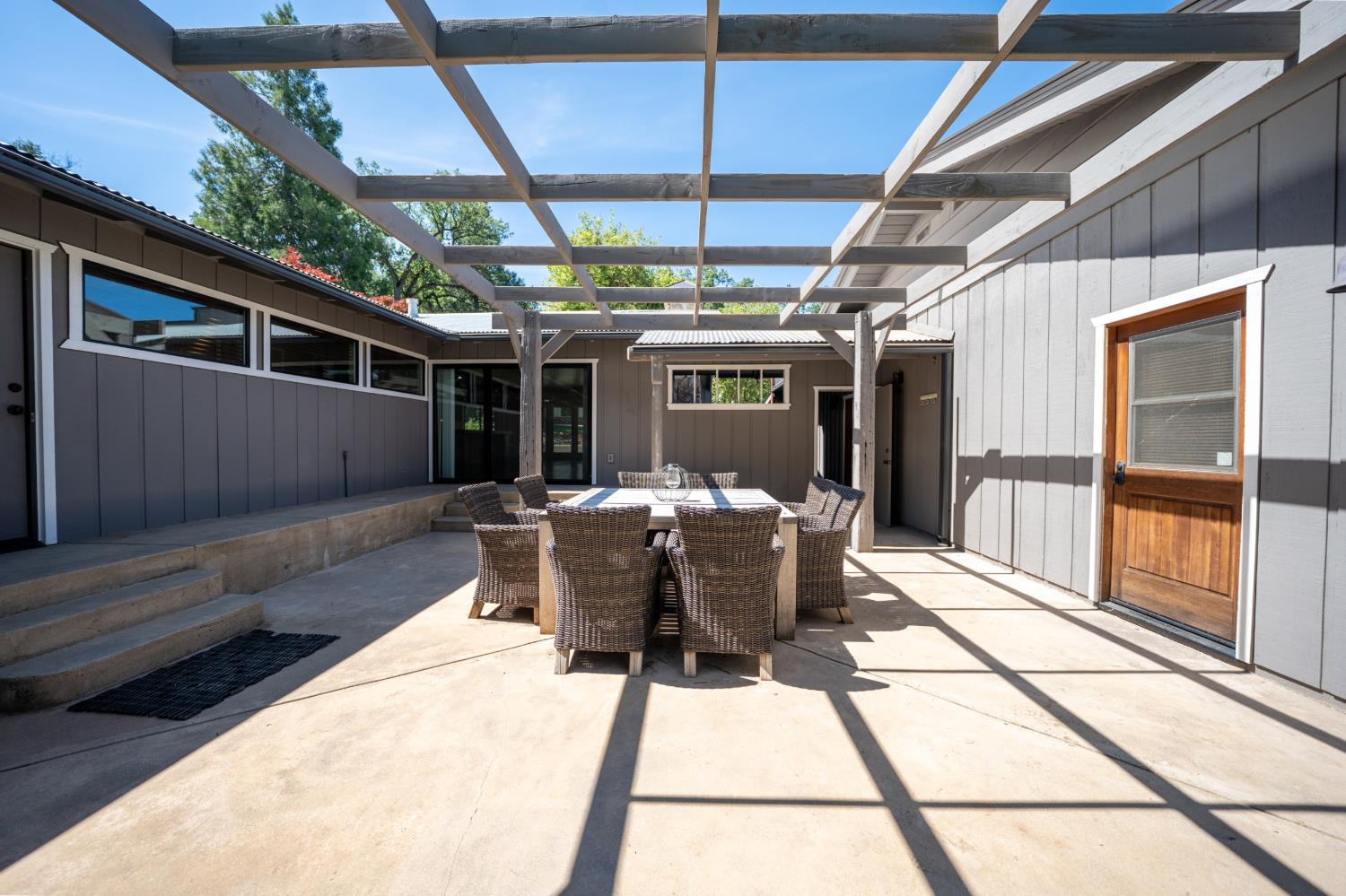 118 Main Street Murphys, CA 95247 - Photo 39 of 47 a view of a patio with table and chairs and wooden fence
