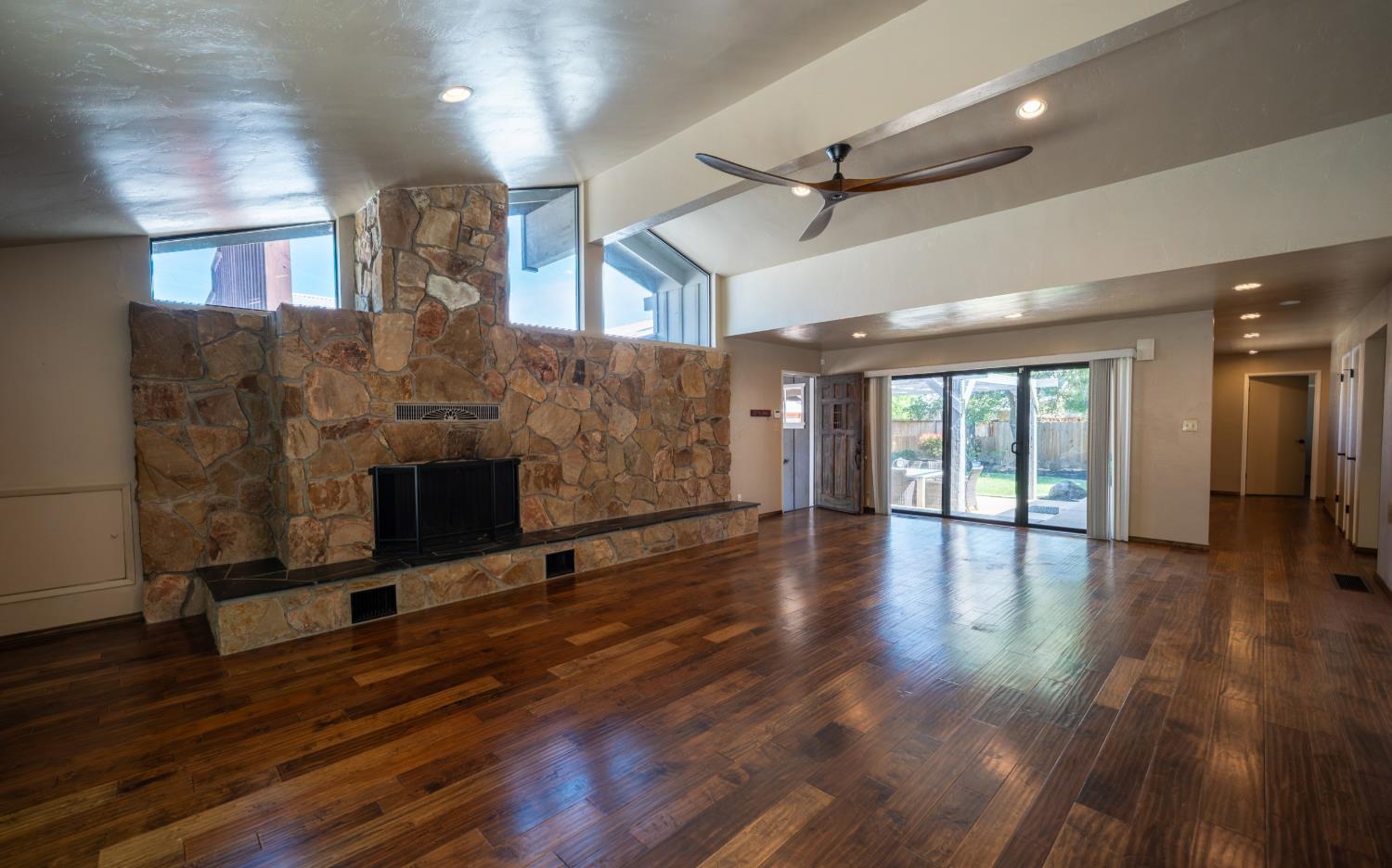 118 Main Street Murphys, CA 95247 - Photo 8 of 47 a view of empty room with wooden floor and fireplace