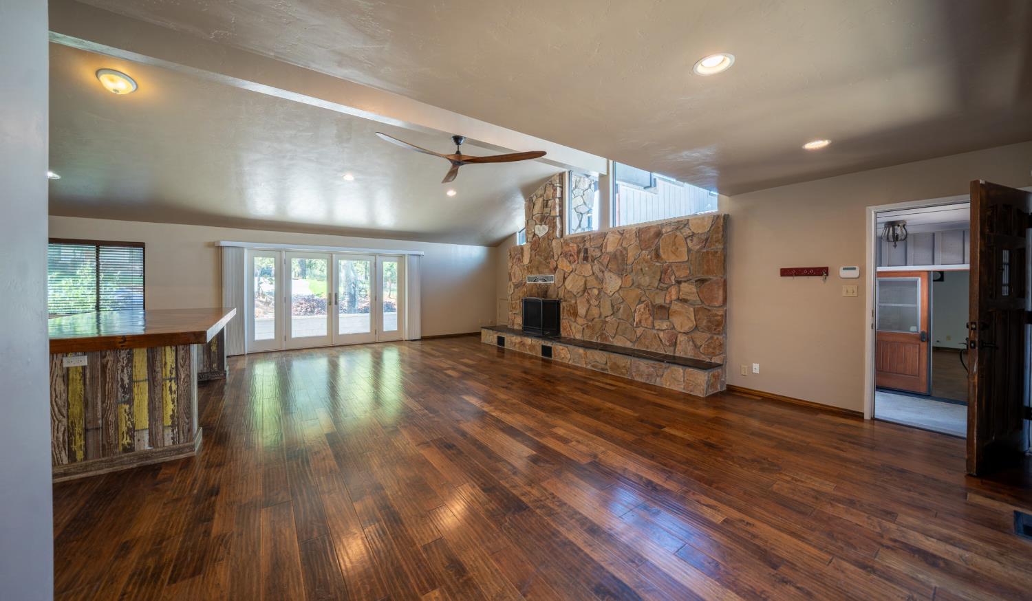 118 Main Street Murphys, CA 95247 - Photo 9 of 47 a view of empty room with wooden floor and fireplace
