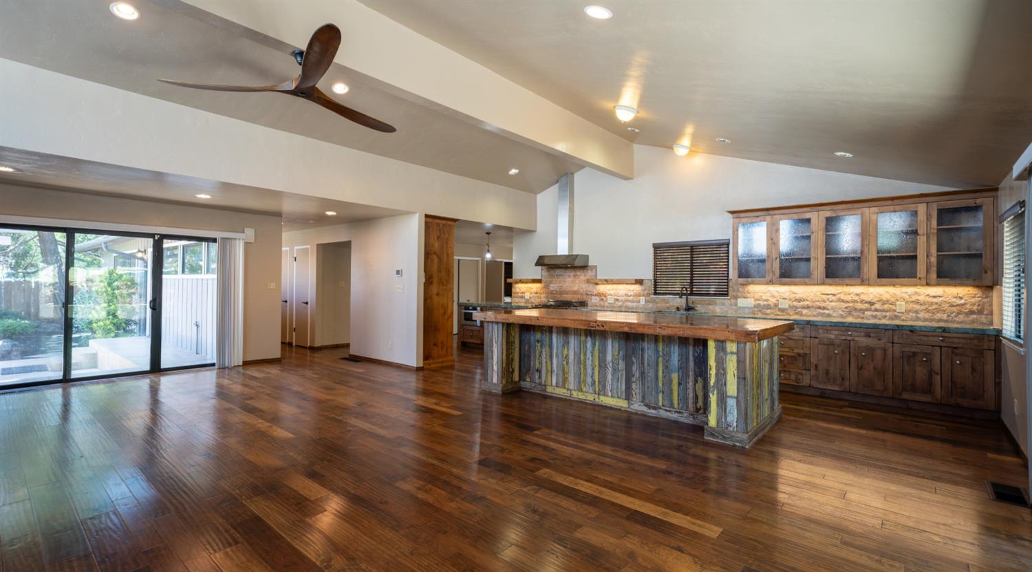 118 Main Street Murphys, CA 95247 - Photo 10 of 47 a open kitchen with stainless steel appliances granite countertop a lot of counter space and wooden floors
