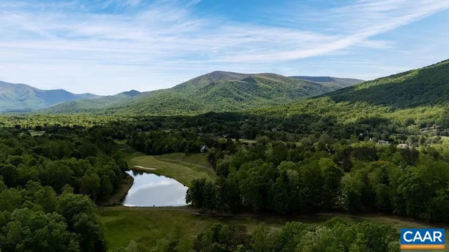 a view of a big yard with lots of green space