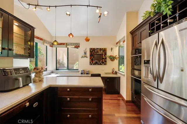a living room filled with furniture and a potted plant