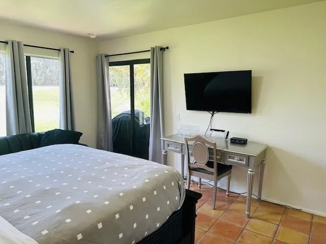 a view of a chair and table in front of a house
