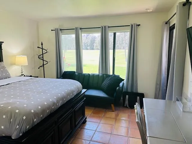 a front view of a house with potted plants