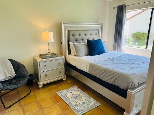 40511 Pebble Beach Circle Palm Desert, CA 92211 - Photo 15 of 26 a bedroom with a bed and window