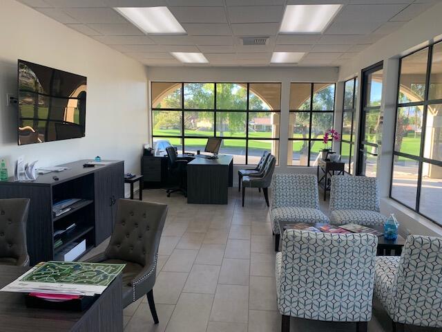 40511 Pebble Beach Circle Palm Desert, CA 92211 - Photo 26 of 26 a living room with furniture and a flat screen tv