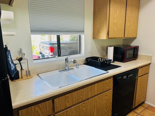 40511 Pebble Beach Circle Palm Desert, CA 92211 - Photo 5 of 26 a kitchen with a sink and cabinets