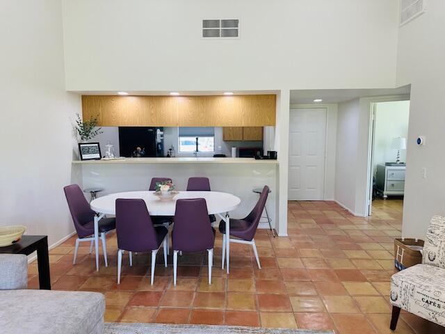 40511 Pebble Beach Circle Palm Desert, CA 92211 - Photo 8 of 26 a view of a dining room with furniture