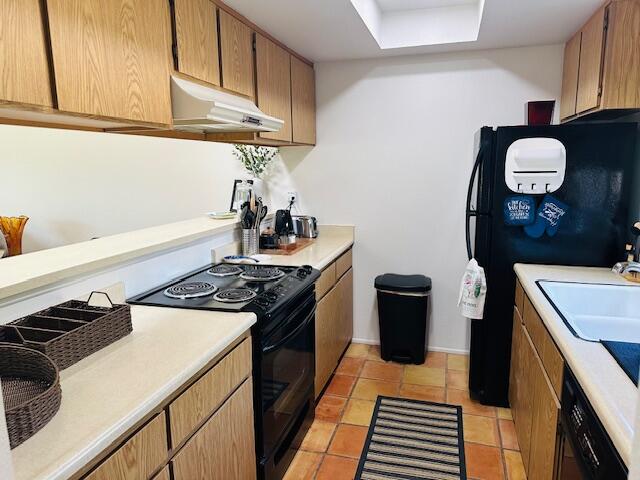 40511 Pebble Beach Circle Palm Desert, CA 92211 - Photo 9 of 26 a kitchen with a stove and a microwave
