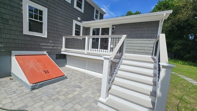 26 Eleanor Road Framingham, MA 01701 - Photo 5 of 15 a view of a house with a large window and stairs