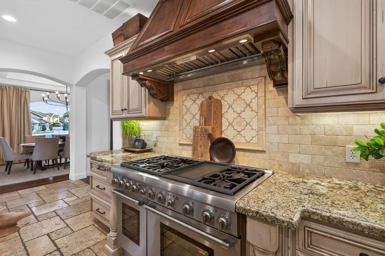 601 Decatur Avenue Clovis, CA 93611 - Photo 17 of 62 a stove top oven sitting inside of a kitchen