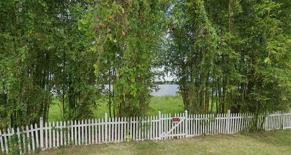 a view of a house with a small yard