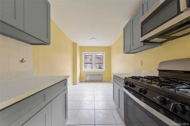 a kitchen with a stove and a cabinet