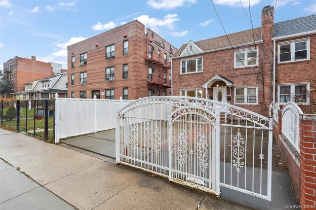a view of a brick building with many windows
