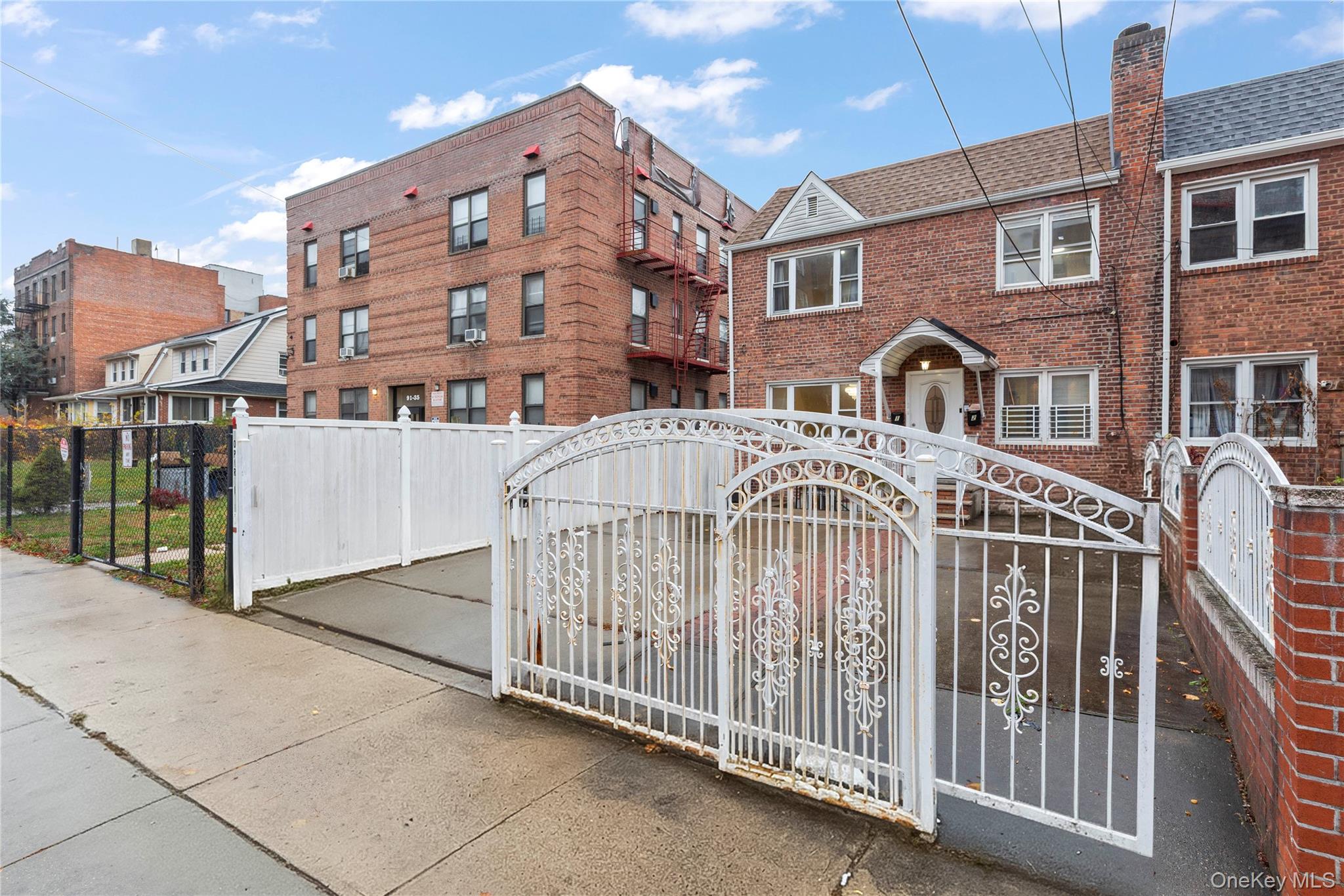 91-41 195th Street Queens, NY 11423 - Photo 4 of 31 a view of a brick building with many windows