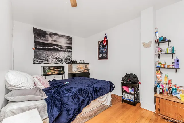 a bed room with a bed and dresser