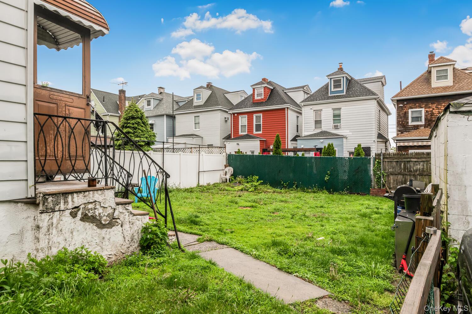32 Alexander Avenue Yonkers, NY 10704 - Photo 14 of 16 a front view of house with yard and green space