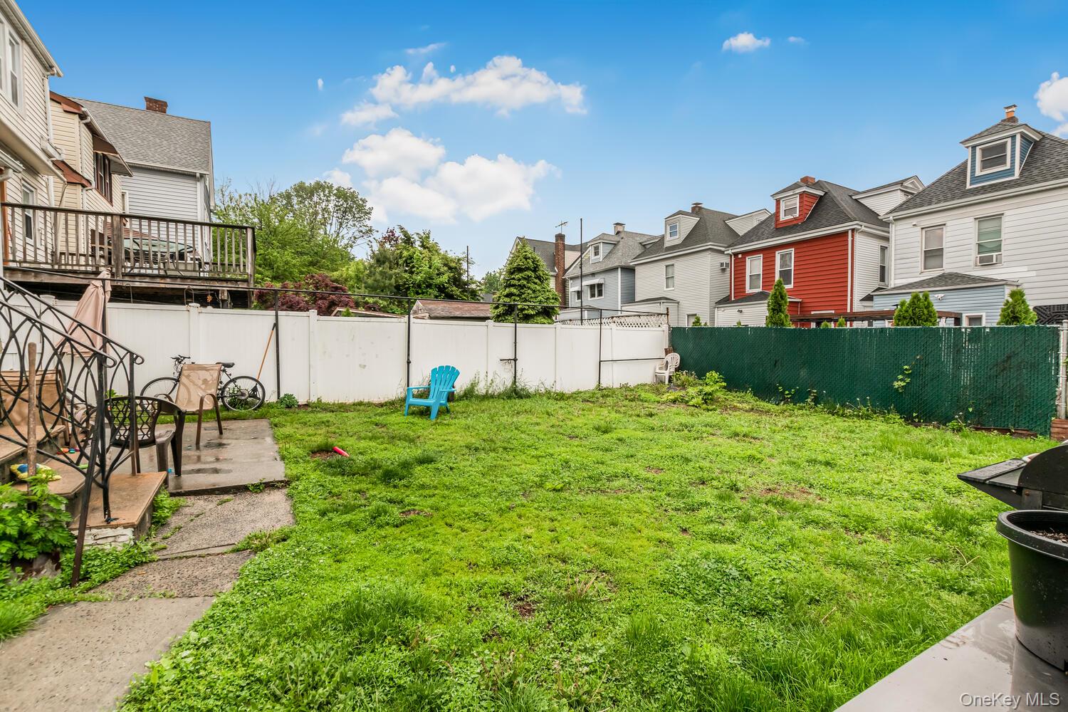 32 Alexander Avenue Yonkers, NY 10704 - Photo 15 of 16 a view of a house with a yard and a fountain