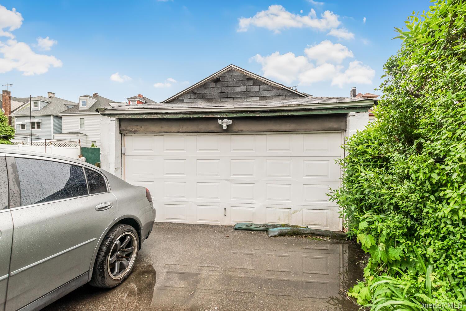32 Alexander Avenue Yonkers, NY 10704 - Photo 4 of 16 a car parked in front of a house