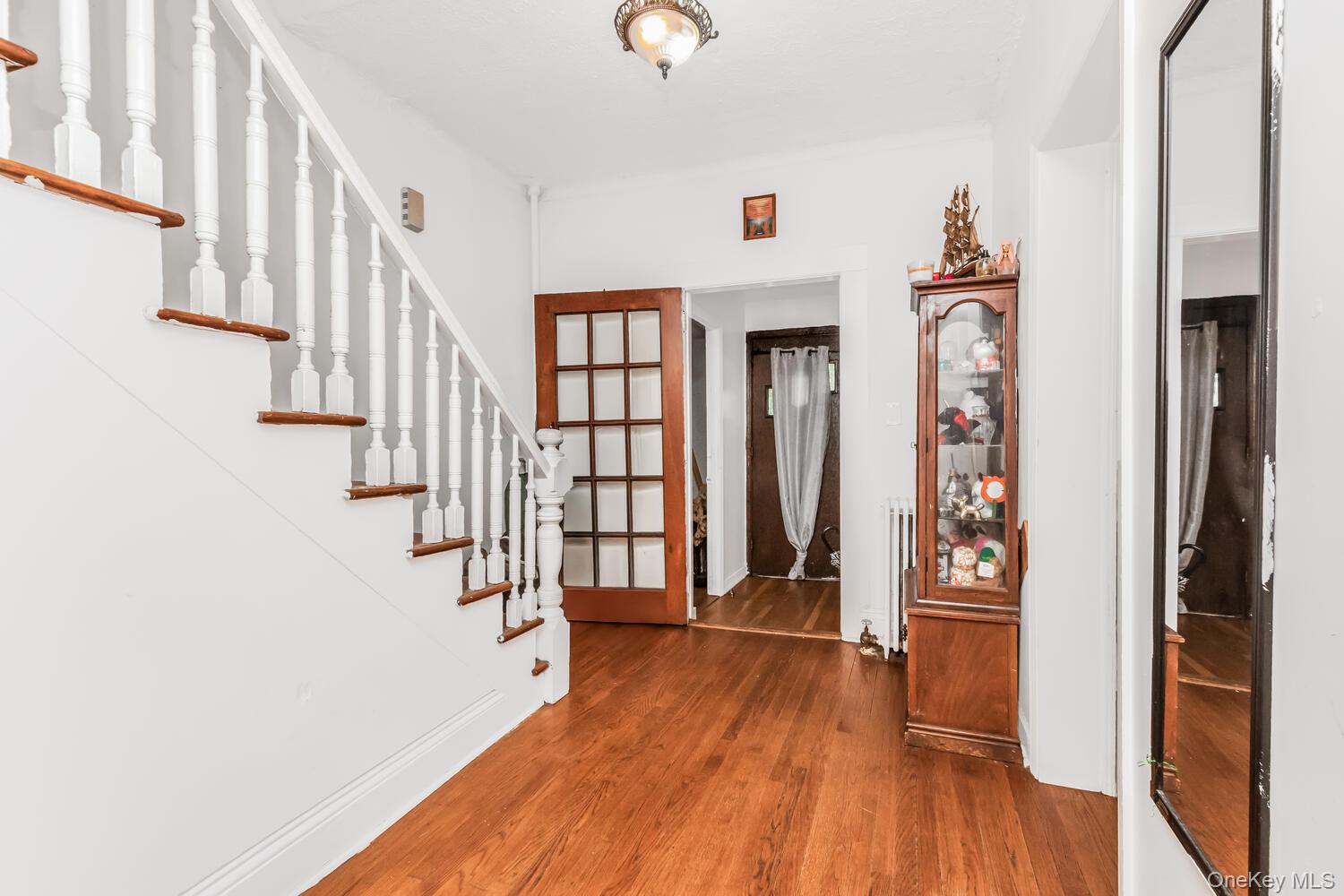 32 Alexander Avenue Yonkers, NY 10704 - Photo 5 of 16 a view of an entryway with wooden floor