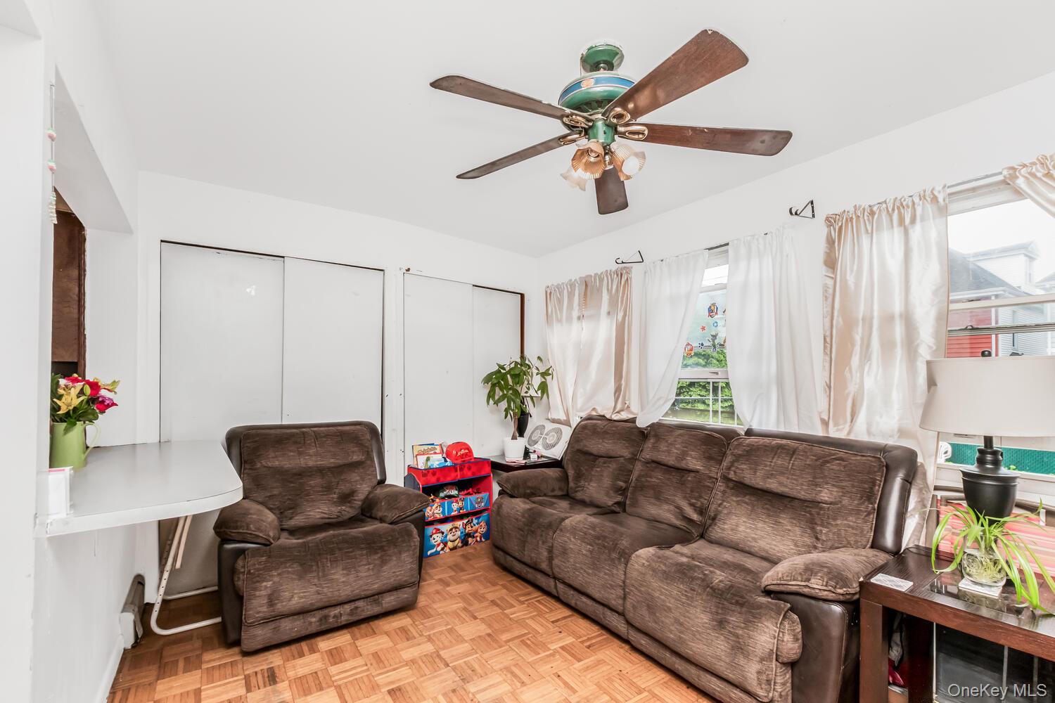 32 Alexander Avenue Yonkers, NY 10704 - Photo 8 of 16 a living room with furniture and a large window