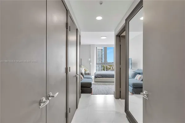 a bedroom with a bed and a mirror