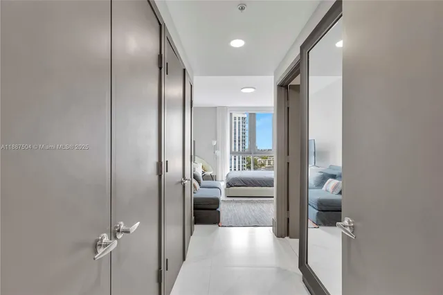 a bedroom with a bed and a mirror