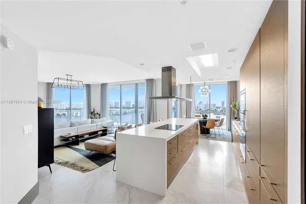 a kitchen with a counter space a sink and cabinets