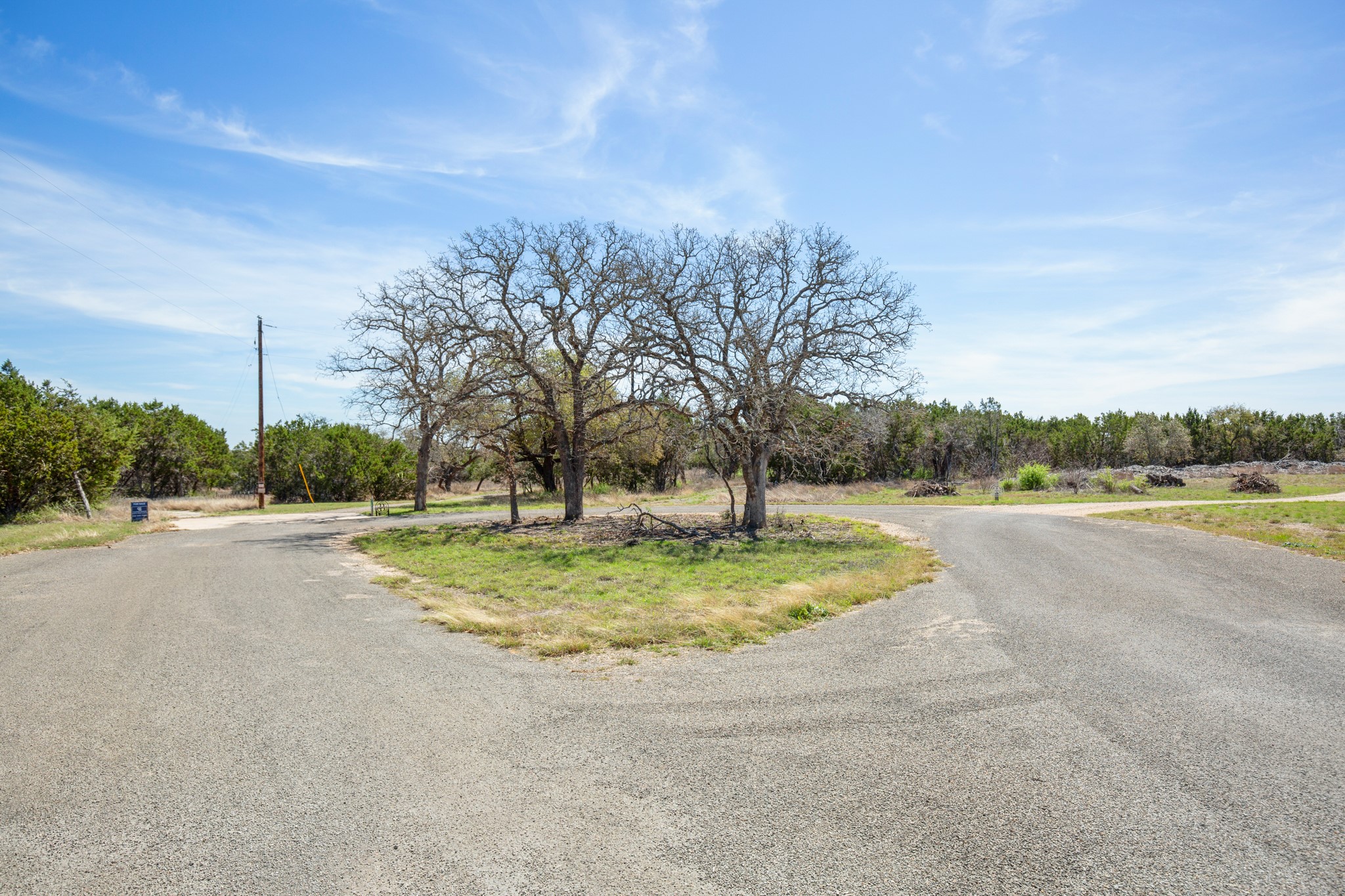 163 Robison Road Bertram, TX 78605 - Photo 6 of 15 The driveway is situated at the end of the cul-de-sac circle.