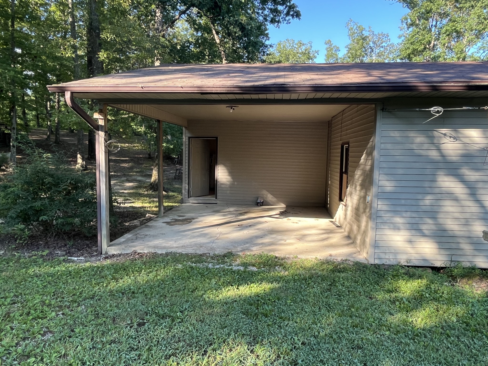 294 Ridgeway Drive Sugar Tree, TN 38380 - Photo 24 of 28 a view of house with backyard outdoor seating and green space