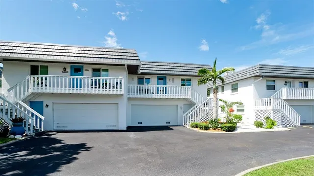 a front view of a house with a garage