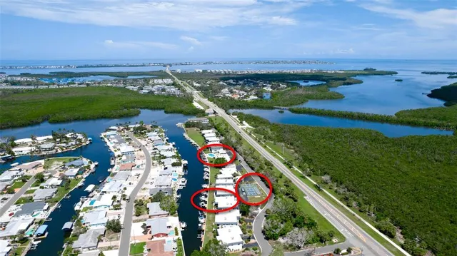 a view of a porch with furniture and floor to ceiling window