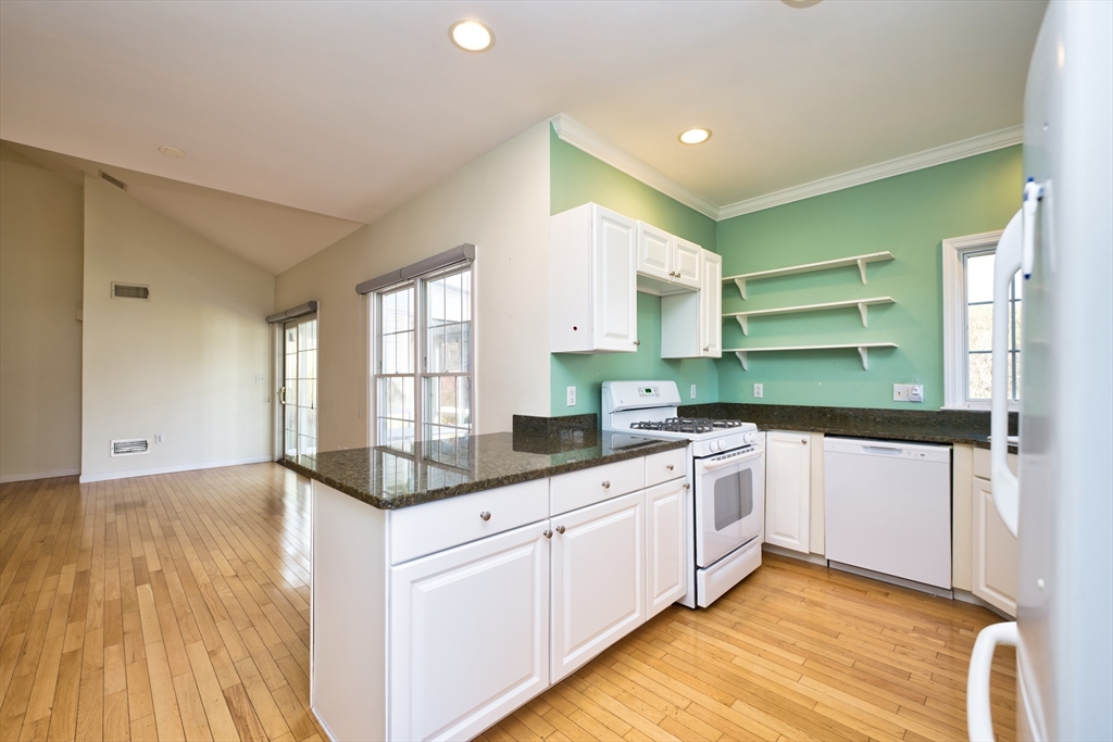 8 Village Way, Unit 8 Westport, MA 02790 - Photo 11 of 29 a kitchen with a sink a window and cabinets