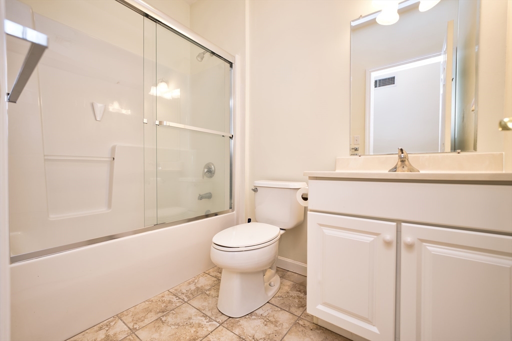 8 Village Way, Unit 8 Westport, MA 02790 - Photo 19 of 29 a bathroom with a sink a toilet and shower