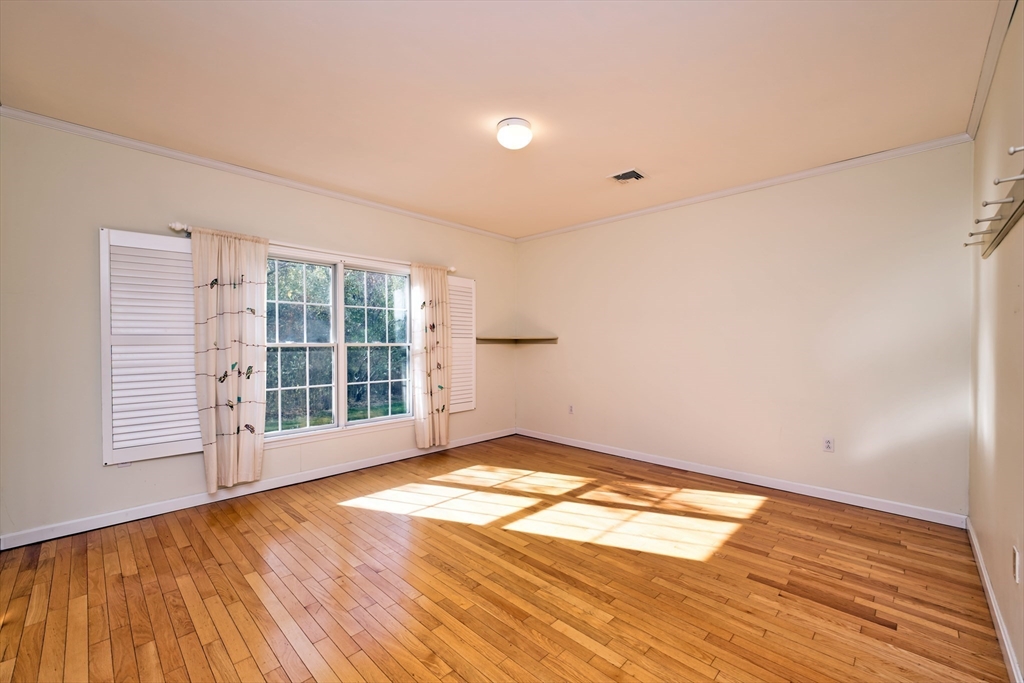 8 Village Way, Unit 8 Westport, MA 02790 - Photo 22 of 29 a view of empty room with wooden floor and fan